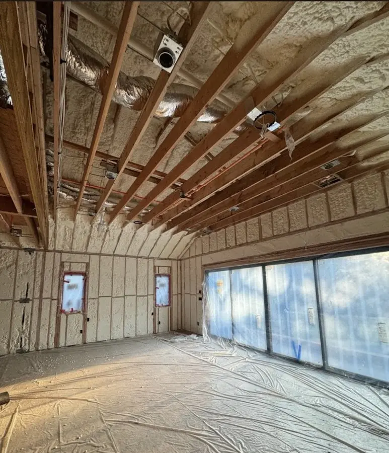Interior walls and ceiling insulated with spray foam during new construction in Salina